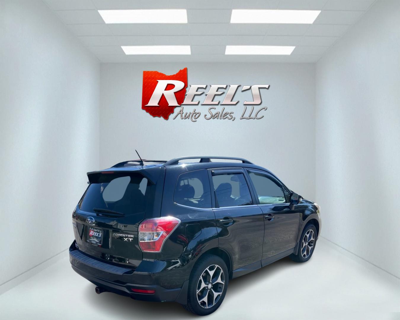 2014 Black /Black Subaru Forester 2.0XT Touring (JF2SJGMC4EH) with an 2.0L H4 SOHC 16V TURBO engine, Automatic transmission, located at 547 E. Main St., Orwell, OH, 44076, (440) 437-5893, 41.535435, -80.847855 - This 2014 Subaru Forester 2.0XT Touring is a well-equipped compact SUV featuring a powerful 2.0L turbocharged engine matched with a continuously variable transmission (CVT) for a blend of performance and efficiency. It boasts a range of high-end amenities, including heated seats, X-Mode for enhanced - Photo#5